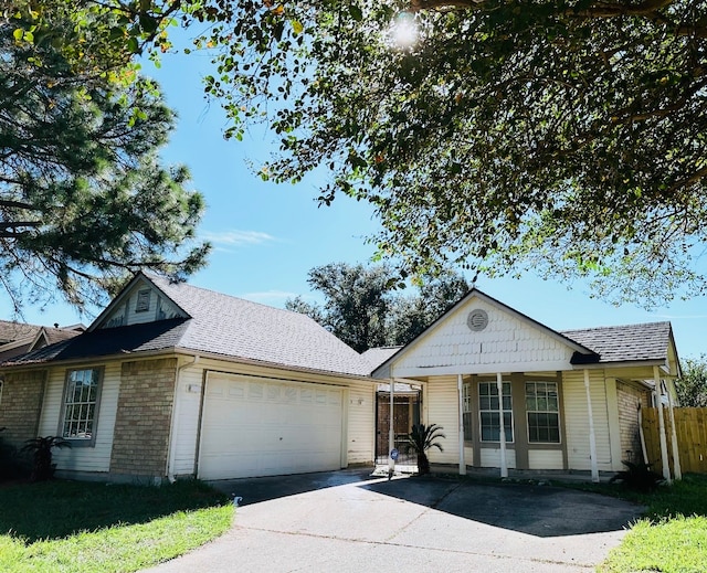 view of front of home featuring a porch and a garage