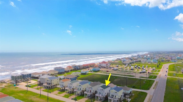 aerial view featuring a water view and a view of the beach