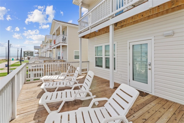 wooden deck featuring a water view