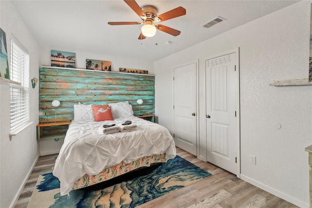 bedroom featuring ceiling fan and light hardwood / wood-style floors