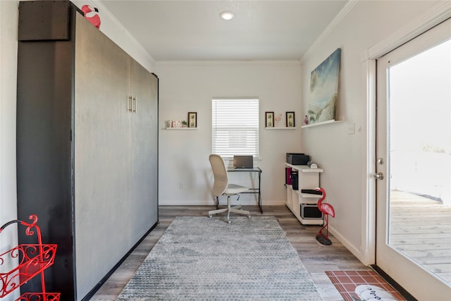 living area with ornamental molding and dark wood-type flooring