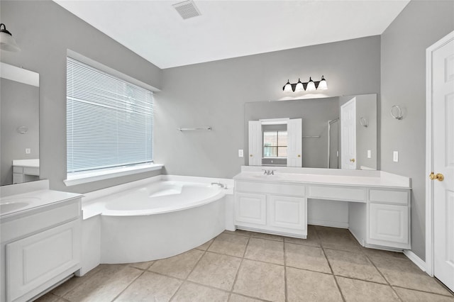 bathroom featuring tile patterned flooring, vanity, and plus walk in shower