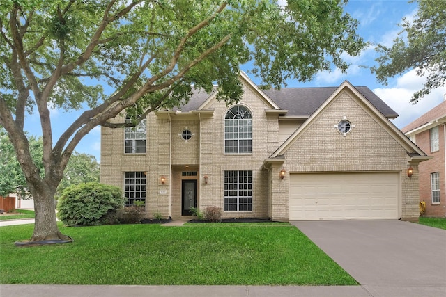 view of front of home featuring a garage and a front lawn