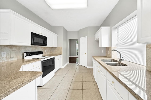 kitchen with white electric range oven, tasteful backsplash, white cabinetry, and sink