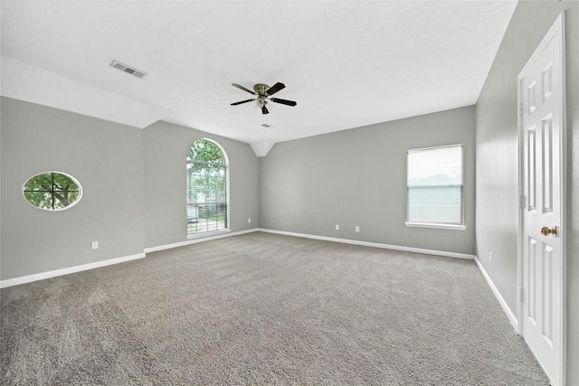 empty room featuring carpet flooring and ceiling fan