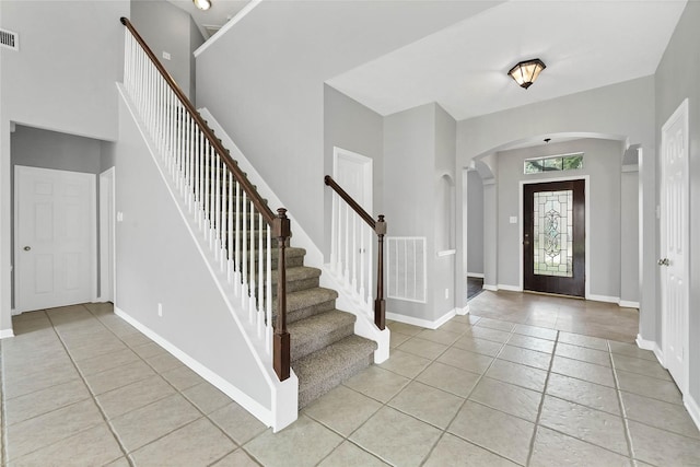 entryway with light tile patterned floors