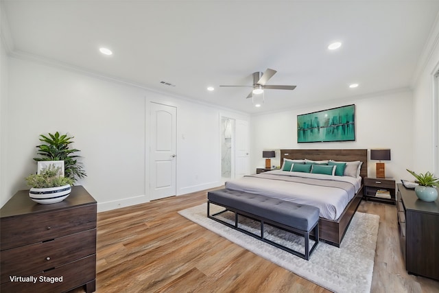 bedroom with ceiling fan, ornamental molding, and light hardwood / wood-style flooring