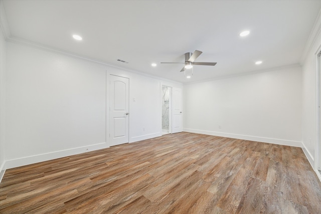 unfurnished room featuring light hardwood / wood-style floors, ceiling fan, and crown molding