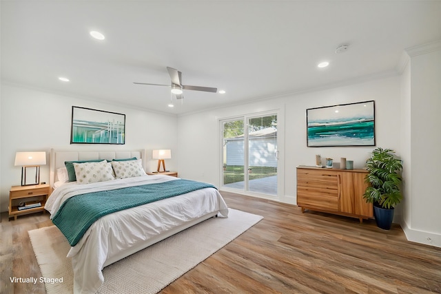 bedroom featuring access to exterior, hardwood / wood-style flooring, ceiling fan, and crown molding