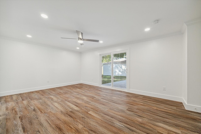 unfurnished room featuring hardwood / wood-style flooring, ceiling fan, and crown molding