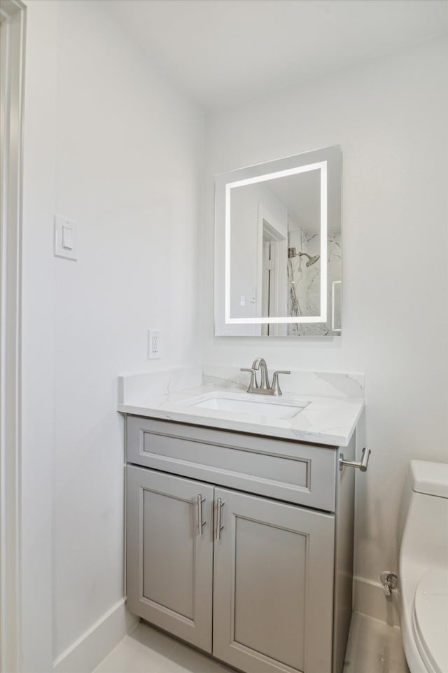 bathroom with vanity and toilet