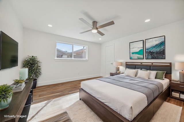 bedroom featuring light wood-type flooring and ceiling fan