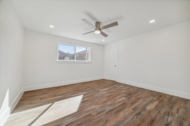 spare room featuring hardwood / wood-style flooring and ceiling fan