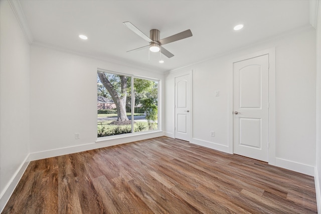 spare room featuring ceiling fan, hardwood / wood-style floors, and ornamental molding