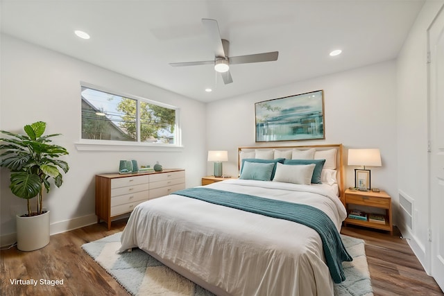 bedroom featuring ceiling fan and dark wood-type flooring