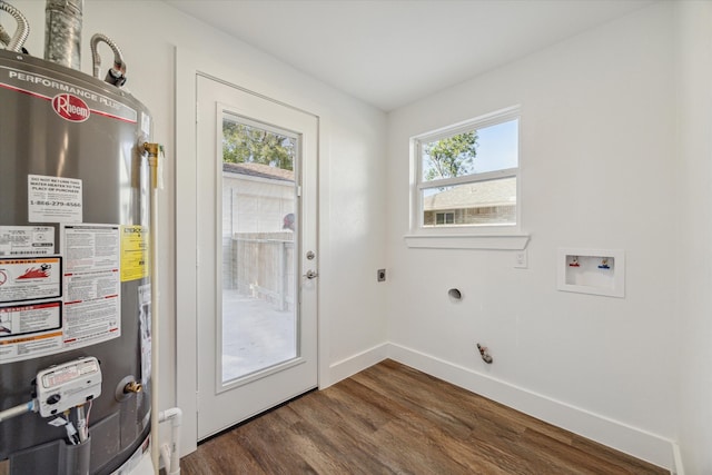 interior space featuring dark hardwood / wood-style floors, a healthy amount of sunlight, and gas water heater