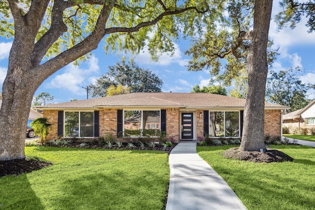 ranch-style home with a front lawn