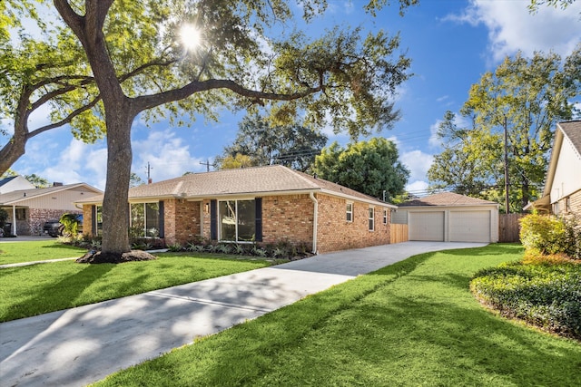 ranch-style home featuring a garage, a front lawn, and an outdoor structure