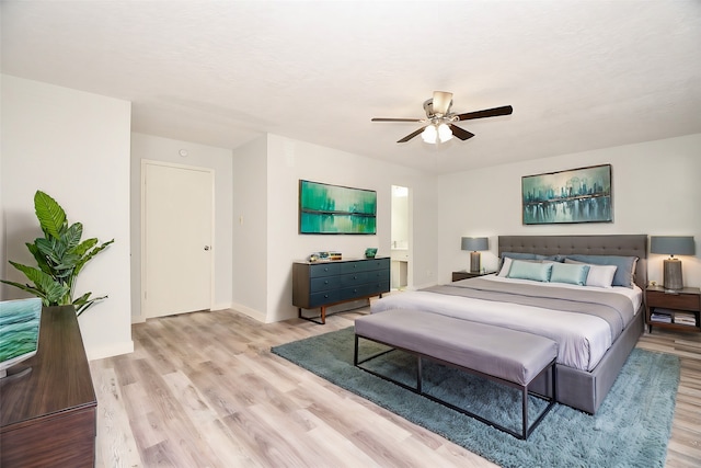 bedroom with ceiling fan and light wood-type flooring