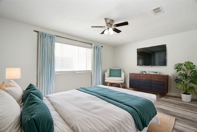 bedroom featuring ceiling fan and wood-type flooring