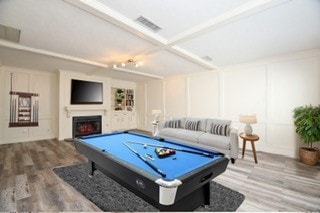 playroom with beamed ceiling, wood-type flooring, and pool table