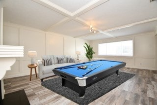 game room with hardwood / wood-style floors, beamed ceiling, pool table, and coffered ceiling