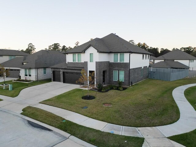 view of front facade featuring a front lawn and a garage