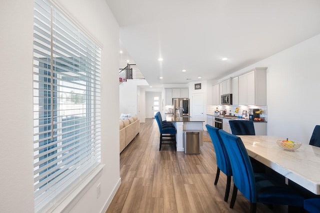 dining area with light hardwood / wood-style floors