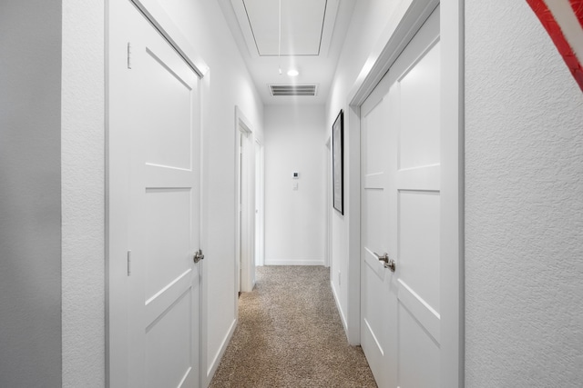 hallway with carpet