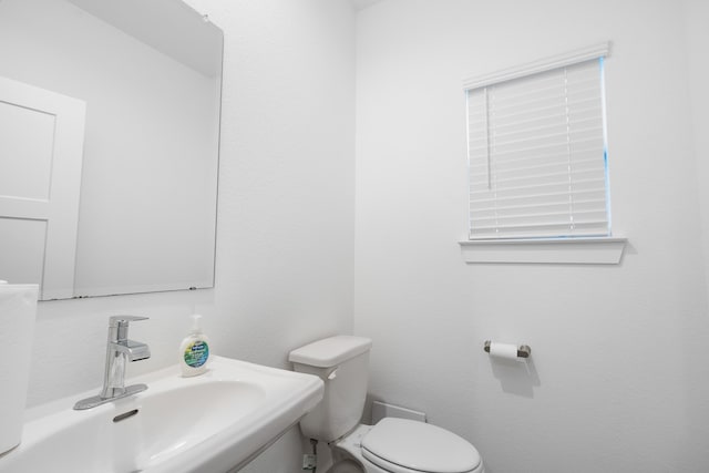 bathroom with sink and toilet