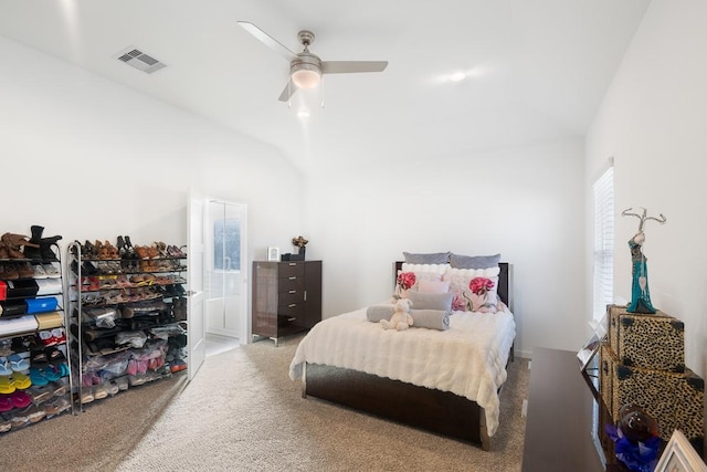 carpeted bedroom featuring ceiling fan and vaulted ceiling