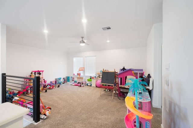 recreation room with ceiling fan and carpet flooring