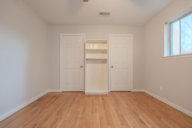 unfurnished bedroom with light hardwood / wood-style floors