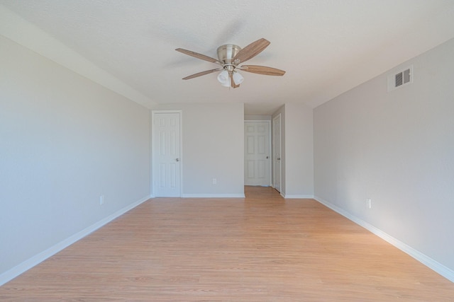 spare room with light hardwood / wood-style flooring and ceiling fan