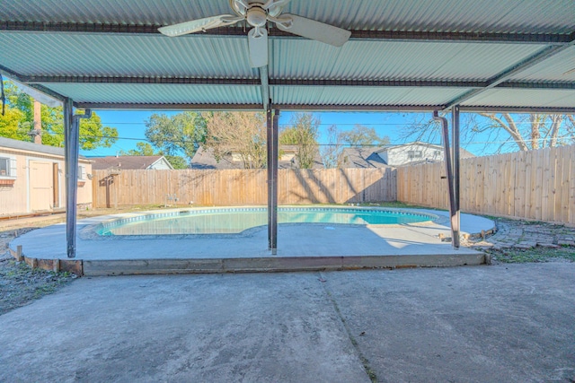 exterior space with ceiling fan and a patio