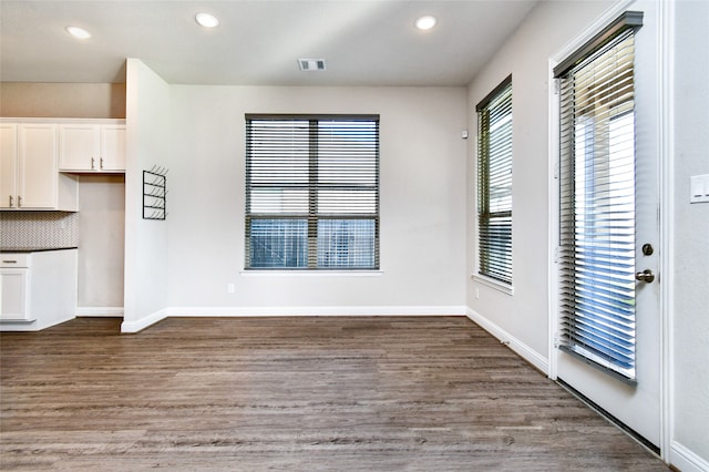 interior space with dark hardwood / wood-style flooring