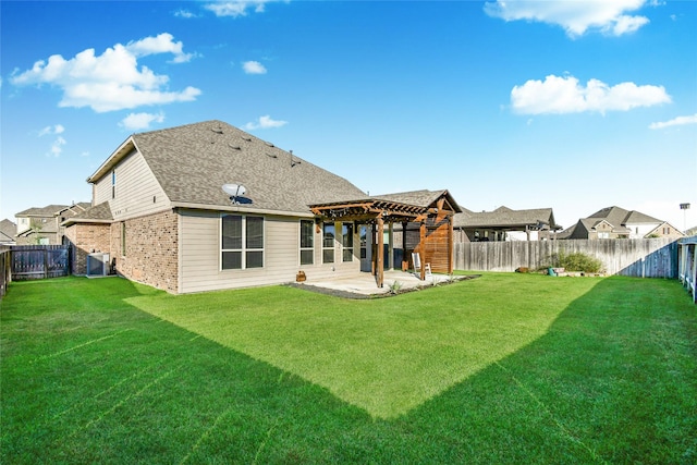 back of property with a patio, a yard, central air condition unit, and a pergola