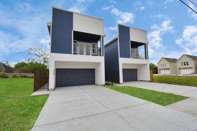 contemporary house featuring a garage and a front yard