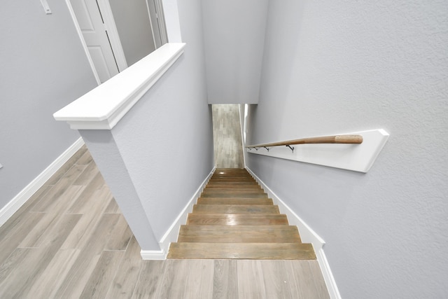 staircase featuring hardwood / wood-style floors