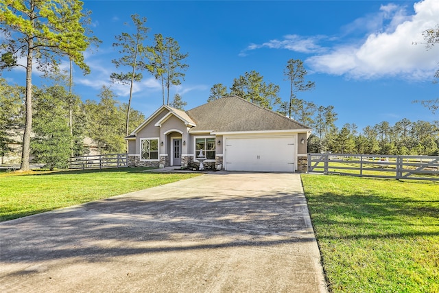 view of front of home with a garage and a front yard