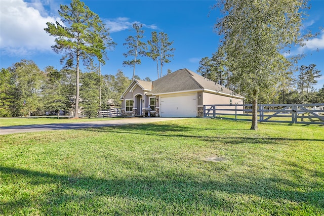 view of front of house featuring a front yard and a garage