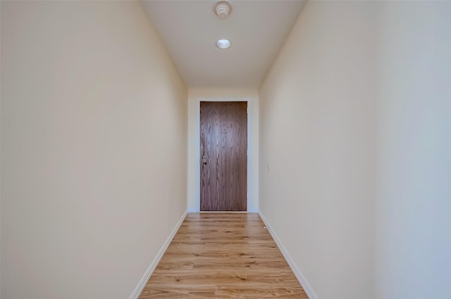 doorway to outside with light wood-type flooring