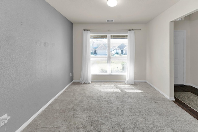 empty room featuring carpet flooring