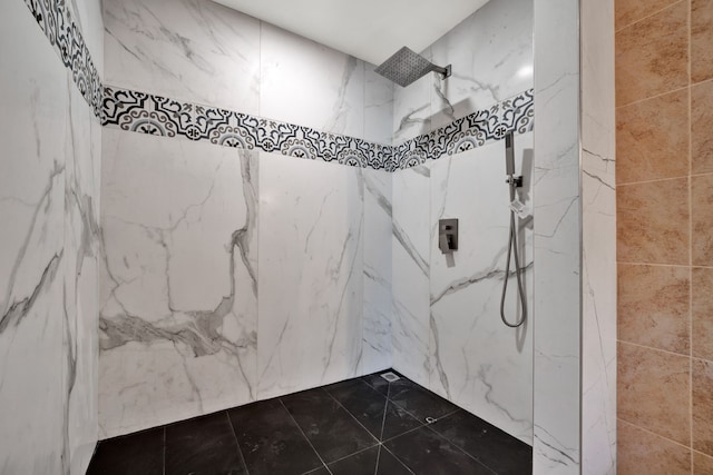 bathroom with a tile shower