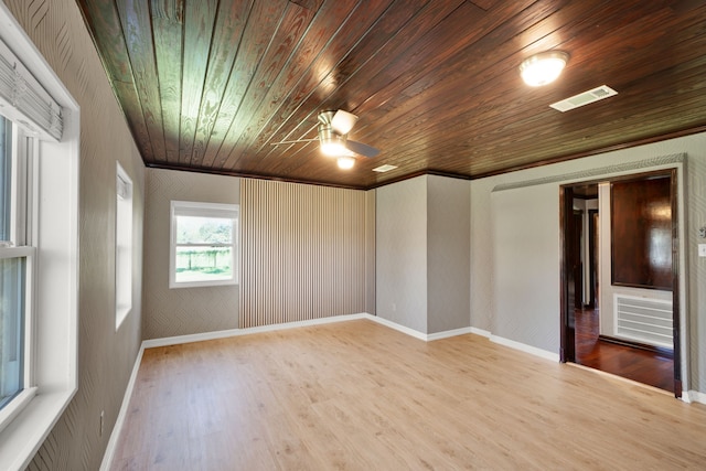 spare room featuring ceiling fan, light wood-type flooring, wood ceiling, and crown molding