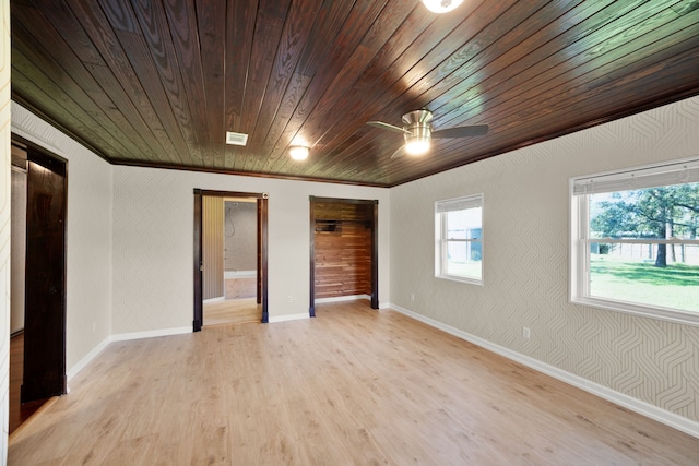 spare room with ceiling fan, wood ceiling, crown molding, and light hardwood / wood-style flooring