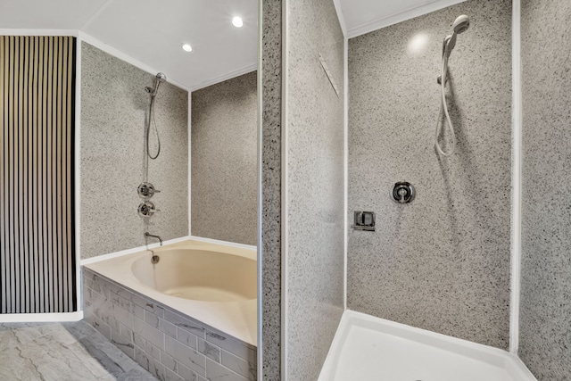 bathroom with shower with separate bathtub and ornamental molding