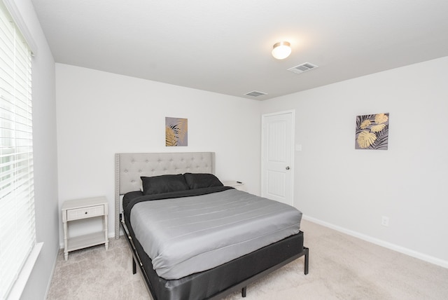 bedroom with light carpet