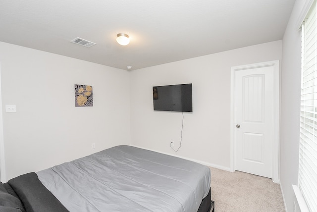 bedroom with light carpet