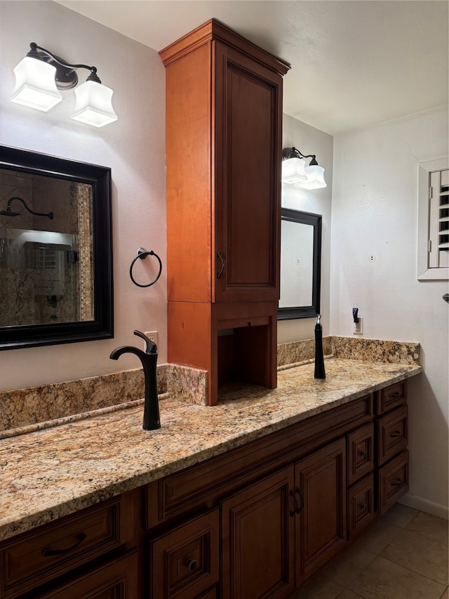 bathroom with tile patterned flooring and vanity